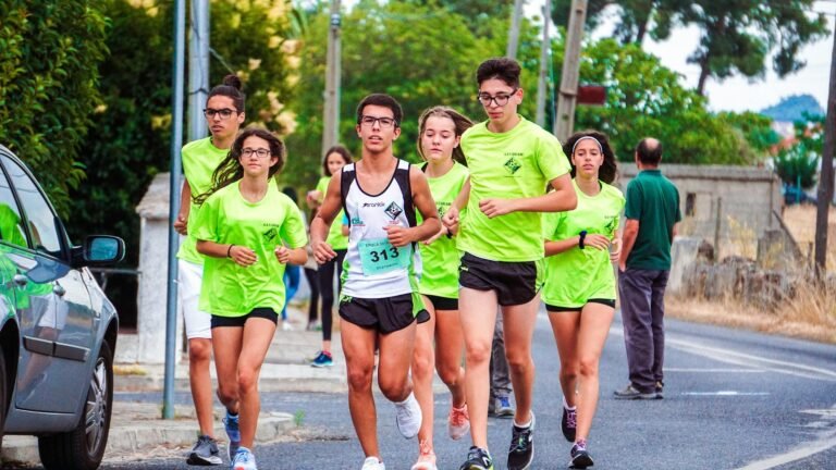 photo of people jogging on road